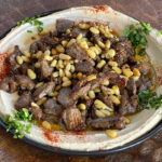 Hummus Bel Lahme with Your choice of Chicken or Beef and Lamb Shawarma